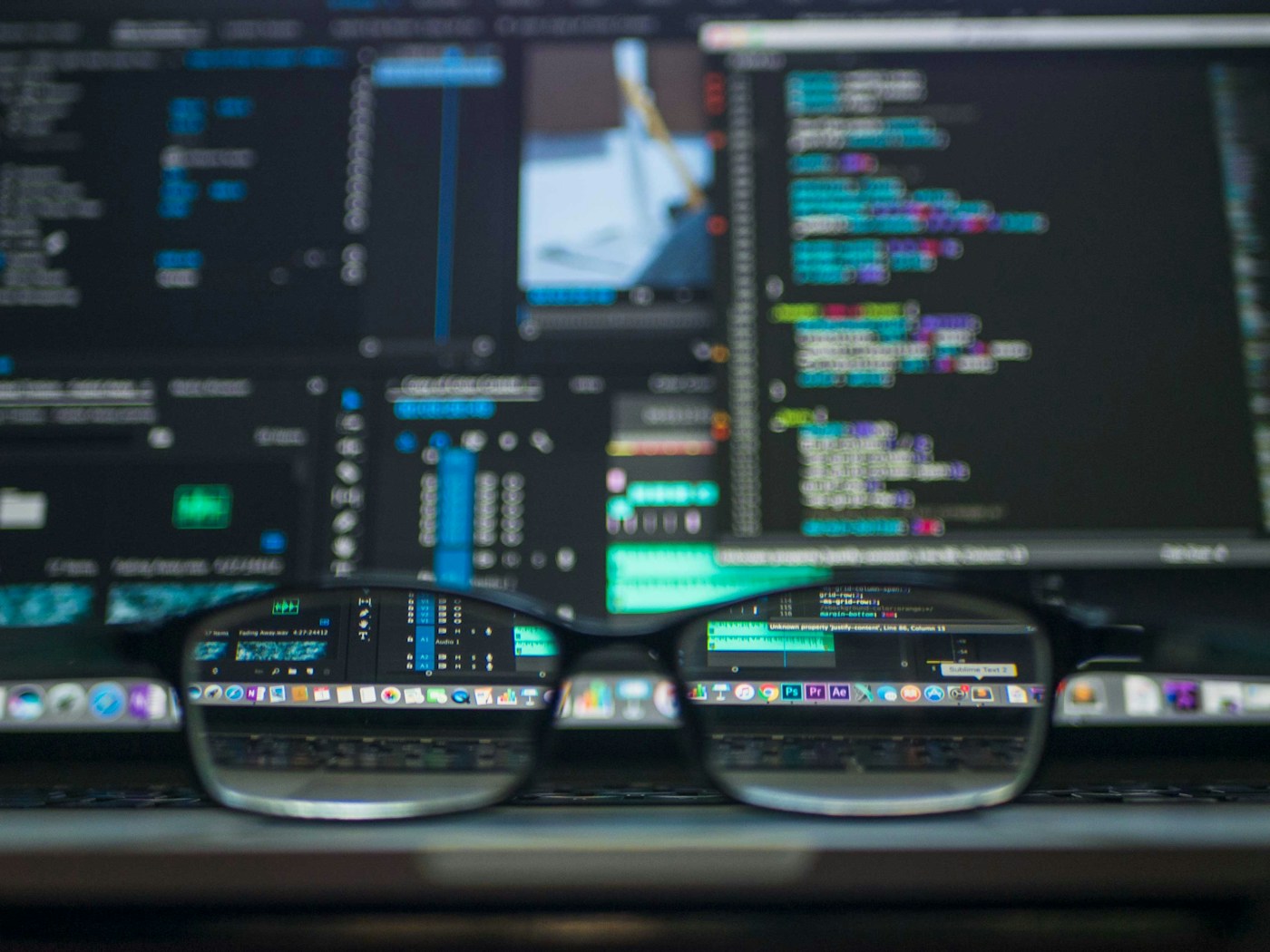 Developer working on code in a dark workspace